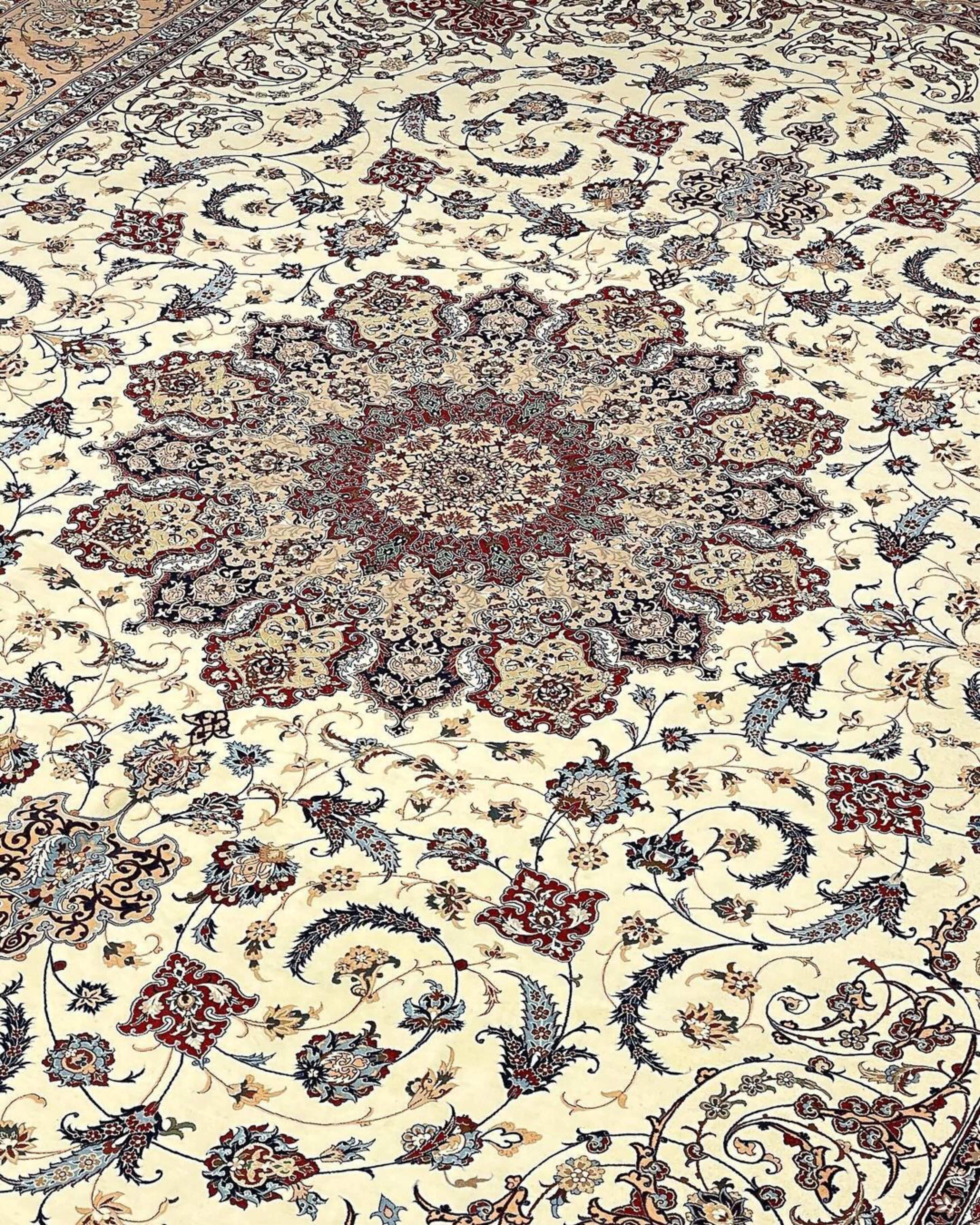 "Luxury Persian rug with cream, blue, and burgundy hues, crafted in Isfahan, Iran."